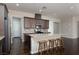 Kitchen featuring a large island with bar seating, stainless steel appliances, and stylish backsplash at 3084 Porte La Paz Ave, Henderson, NV 89044