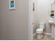 Powder room featuring neutral walls, a pedestal sink, and a tile floor at 3084 Porte La Paz Ave, Henderson, NV 89044
