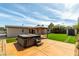 Serene backyard with a hot tub, pergola, shed, and well-maintained artificial grass at 3308 Navajo Way, Las Vegas, NV 89108