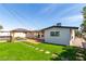 Backyard oasis featuring a manicured lawn, pergola, and hot tub for ultimate outdoor relaxation at 3308 Navajo Way, Las Vegas, NV 89108