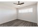This bedroom features a ceiling fan and a window that lets in plenty of natural light at 3308 Navajo Way, Las Vegas, NV 89108