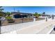 Single-story home featuring mature landscaping, modern fence and xeriscaped front yard at 3308 Navajo Way, Las Vegas, NV 89108