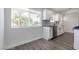 Bright kitchen features white cabinets, granite counters, stainless appliances, and a farmhouse sink at 3308 Navajo Way, Las Vegas, NV 89108