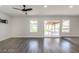 Bright living room with modern gray flooring and sliding glass doors to the backyard at 3308 Navajo Way, Las Vegas, NV 89108