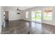 Bright living room with modern gray flooring and sliding glass doors to the backyard at 3308 Navajo Way, Las Vegas, NV 89108
