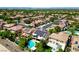This aerial shows a beautiful desert neighborhood with houses, many with solar panels, and mountain views at 335 Pleasant Summit Dr, Henderson, NV 89012