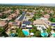 An aerial view showcases a lovely neighborhood with houses, many with pools, and mountain views in the background at 335 Pleasant Summit Dr, Henderson, NV 89012