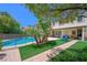 Beautiful backyard with a swimming pool, artificial turf, and lounging furniture at 335 Pleasant Summit Dr, Henderson, NV 89012