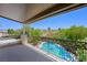 Enjoy pool views from this home's private balcony that features decorative metal railings and shaded cover at 335 Pleasant Summit Dr, Henderson, NV 89012