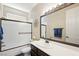 Bright bathroom features a single sink with bronze fixtures and a shower-tub combo at 335 Pleasant Summit Dr, Henderson, NV 89012