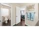Bathroom with toilet, shower, and towel rack beside an opened white door at 335 Pleasant Summit Dr, Henderson, NV 89012