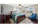 Cozy bedroom with ceiling fan, wood floors, and natural light from the window at 335 Pleasant Summit Dr, Henderson, NV 89012