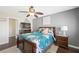 Bedroom featuring dark wood floors, a ceiling fan, and a floral bedspread at 335 Pleasant Summit Dr, Henderson, NV 89012