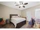 Cozy bedroom featuring a ceiling fan and comfortable furnishings, creating a relaxing retreat within the home at 335 Pleasant Summit Dr, Henderson, NV 89012