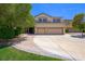 Two-story home with a three-car garage and well-maintained landscaping at 335 Pleasant Summit Dr, Henderson, NV 89012