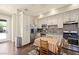 Bright kitchen offers stainless steel appliances, granite counters, and a cozy breakfast nook, perfect for casual dining at 335 Pleasant Summit Dr, Henderson, NV 89012