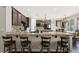 Kitchen with granite countertops, dark wood cabinets, and counter seating at 335 Pleasant Summit Dr, Henderson, NV 89012