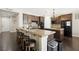 Kitchen with granite countertops, dark wood cabinets, and seating at the counter at 335 Pleasant Summit Dr, Henderson, NV 89012