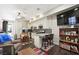 Open kitchen has granite counters, white cabinetry, stainless appliances and a dining area perfect for everyday dining at 335 Pleasant Summit Dr, Henderson, NV 89012