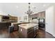 Open kitchen featuring granite countertops, modern appliances, and dark wood cabinets at 335 Pleasant Summit Dr, Henderson, NV 89012