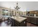 Kitchen with island, stainless appliances, granite countertops, and dining area overlooking pool at 335 Pleasant Summit Dr, Henderson, NV 89012