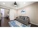 Comfortable living room with hardwood floors, blue area rug and neutral paint at 335 Pleasant Summit Dr, Henderson, NV 89012