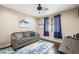 Comfortable living room with large window, overhead fan and neutral decor at 335 Pleasant Summit Dr, Henderson, NV 89012