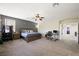 Spacious main bedroom with accent wall, ceiling fan, and carpet at 335 Pleasant Summit Dr, Henderson, NV 89012