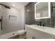 Stylish bathroom showcasing decorative tile, matte black finishes, and a stand-up shower at 3572 Tempe St, Las Vegas, NV 89103