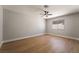 This bedroom has wood floors, neutral walls, and a modern ceiling fan at 3572 Tempe St, Las Vegas, NV 89103