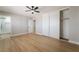 Open bedroom with wood flooring, a closet with sliding doors, and a ceiling fan at 3572 Tempe St, Las Vegas, NV 89103