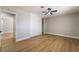 Spacious bedroom boasts wood floors, a ceiling fan, and a closet with sliding doors at 3572 Tempe St, Las Vegas, NV 89103