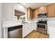 Close up of updated kitchen featuring stainless steel appliances and modern countertops at 3572 Tempe St, Las Vegas, NV 89103
