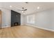 Light-filled living room showcasing an accent fireplace and new hardwood floors at 3572 Tempe St, Las Vegas, NV 89103
