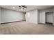 Large main bedroom with carpet, ceiling fan, and walk-in closet at 3572 Tempe St, Las Vegas, NV 89103