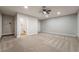 Spacious carpeted main bedroom with ceiling fan, en-suite bathroom, and closet at 3572 Tempe St, Las Vegas, NV 89103
