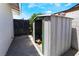 Backyard shed for storage with a sliding door, concrete floor, and gated access at 3572 Tempe St, Las Vegas, NV 89103