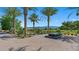 Beautiful entrance with palm trees, stone pavers, desert plants, and a tranquil fountain at 4130 E Brusca Way, Pahrump, NV 89061