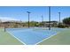 Scenic view of outdoor tennis courts with landscaping and community buildings under clear blue sky at 4130 E Brusca Way, Pahrump, NV 89061