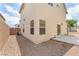 Spacious backyard with gravel, patio, and block wall offering privacy at 4252 Olympic Point Dr, Las Vegas, NV 89129