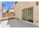 Backyard features a concrete patio and sliding door that enhances indoor-outdoor living at 4252 Olympic Point Dr, Las Vegas, NV 89129