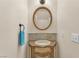 Charming half bathroom featuring a decorative sink, vanity, and elegant fixtures at 4252 Olympic Point Dr, Las Vegas, NV 89129