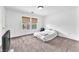 Bright bedroom with ample natural light, soft carpet, and spacious layout at 4252 Olympic Point Dr, Las Vegas, NV 89129