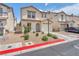Charming two-story home showcasing a desert landscape, attached garage, and welcoming front entrance at 4252 Olympic Point Dr, Las Vegas, NV 89129