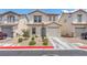 Charming two-story home featuring a desert landscape, attached garage, and inviting front entrance at 4252 Olympic Point Dr, Las Vegas, NV 89129