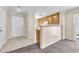 Open-concept space blending the entryway, kitchen, and living room, perfect for entertaining at 4252 Olympic Point Dr, Las Vegas, NV 89129