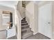 Carpeted staircase leading to the upper level, adjacent to a well-lit living area at 4252 Olympic Point Dr, Las Vegas, NV 89129