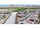 Aerial view of a residential area in the desert, showcasing neighborhood layout and surrounding landscape at 440 Blue Lark Dr, Henderson, NV 89011