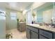 Bright bathroom featuring double sinks with granite countertop and ample lighting at 440 Blue Lark Dr, Henderson, NV 89011