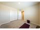Neutral bedroom featuring a closet, carpet, and view into the hallway at 440 Blue Lark Dr, Henderson, NV 89011